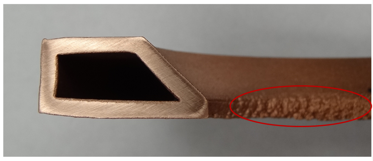 Fluxtrol | Best Practice for Design and Manufacturing of Heat Treating Inductors - Figure 3: Example of overheated inductor loop due to poor cooling or improper concentrator design (encircled in red). The cross-section shown is similar to the modeled cross-section.