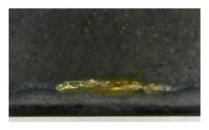 Fluxtrol | ASM HTS 2019 Improving Corrosion Resistance of Soft Magnetic Composites for Induction Heat Treating Applications Figure 2 - Close up of corrosion of Fluxtrol 100 sample coated with material A with additional surface treatment after 168 hours of humidity testing.