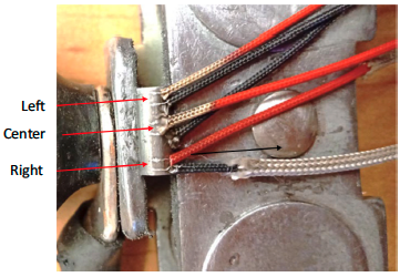 Fluxtrol | Specimen Design, Heating Rate, and Temperature Gradients during Heating in an Induction Heated Dilatometer Figure 5 - Thermocouple leads welded to the surface of the 4 mm diameter by 10 mm long 1045 steel specimen near the center and both ends